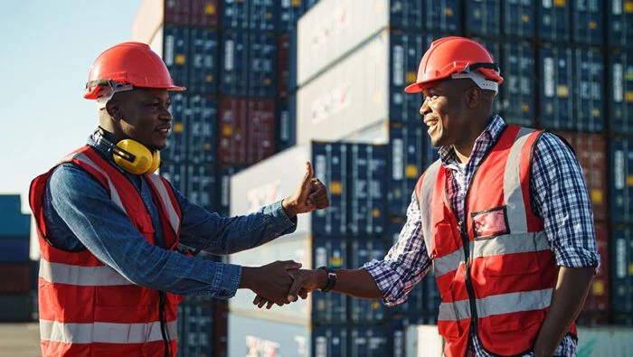 A conversation between people working around container operations